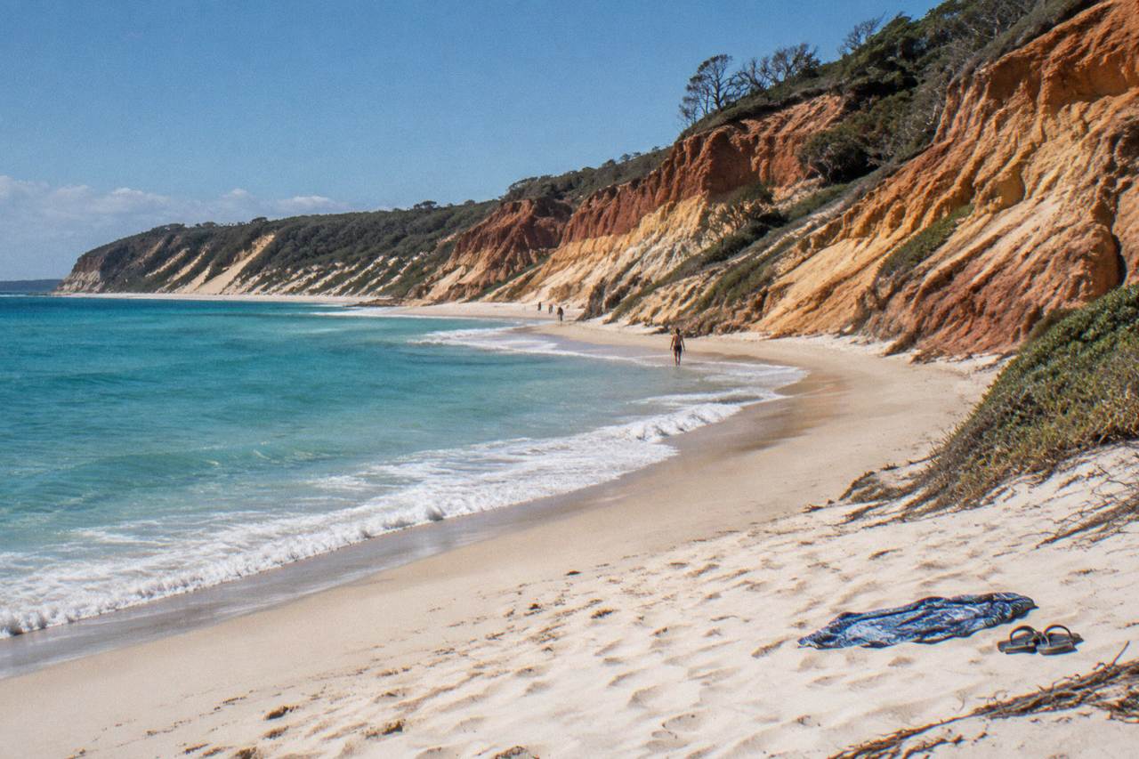 White sand beach and turquoise water along a Queensland coastline